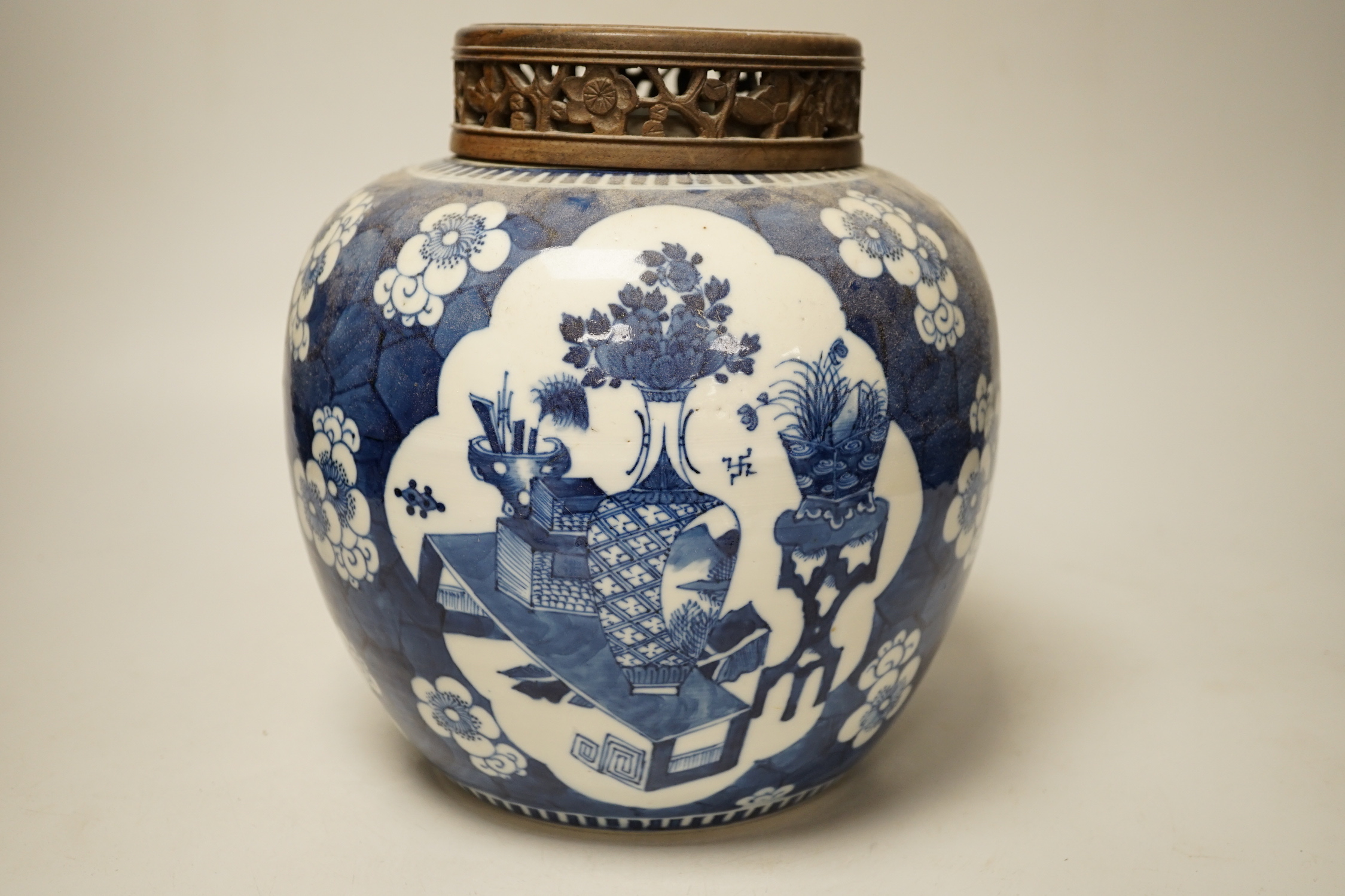 A 19th century Chinese blue and white prunus jar and carved wood cover, 24cm